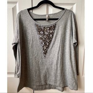 Oversized, quarter length sleeve top.
